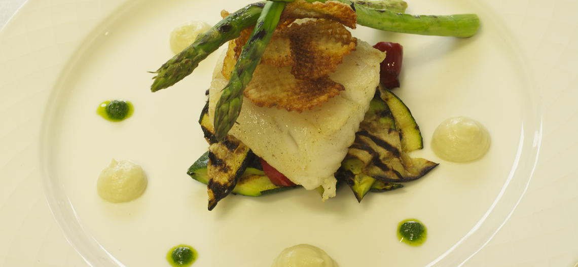 Atlantic pollock with fennel purée, herb coulis and roasted vegetables